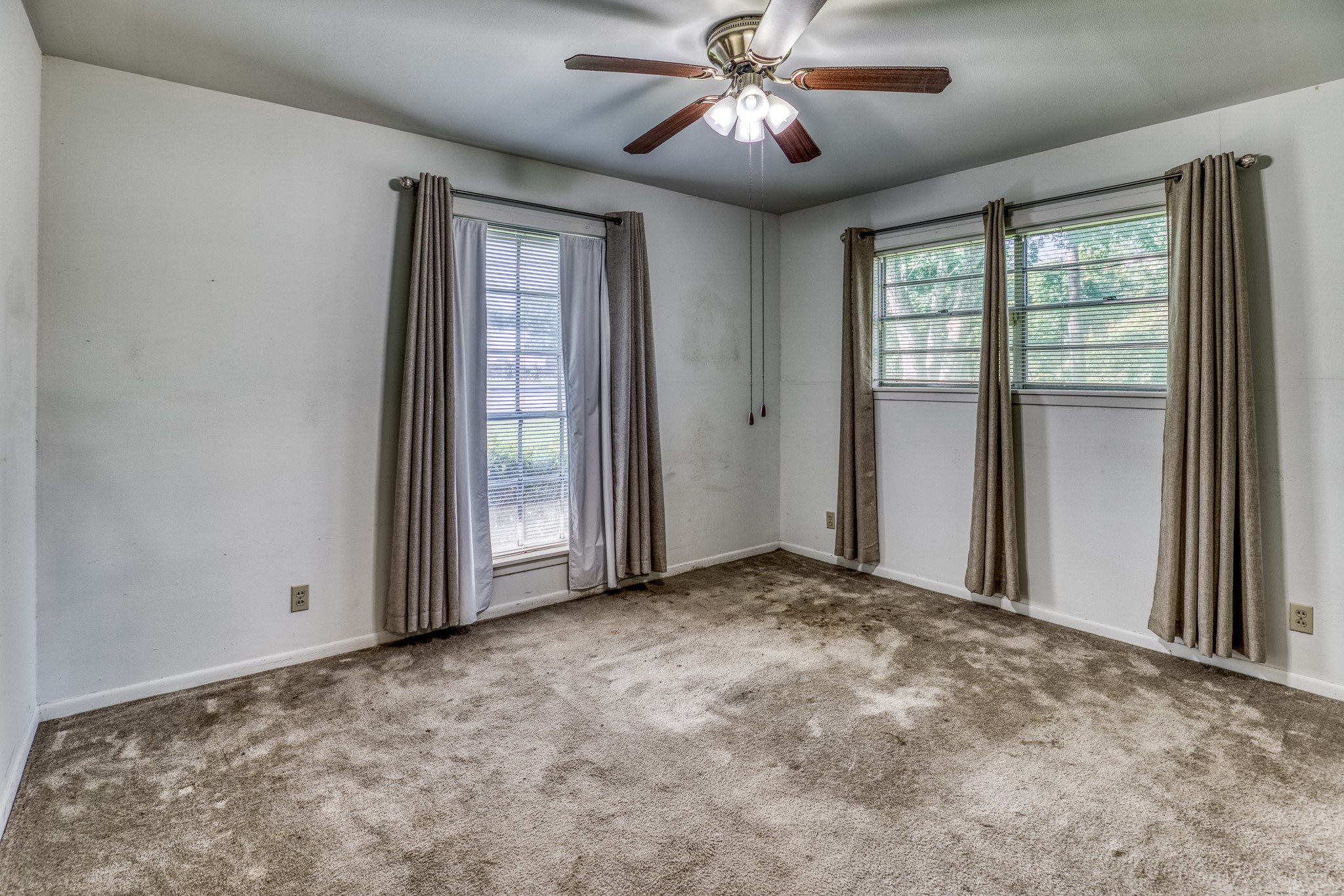 1687 Eagle Lake Road Sealy, TX 77474 - Photo 19 of 27 a view of a livingroom with a ceiling fan and window