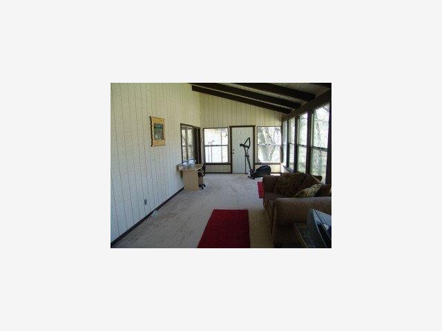 5677 Swiss Ranch Road Mountain Ranch, CA 95246 - Photo 5 of 9 a living room with furniture and a window