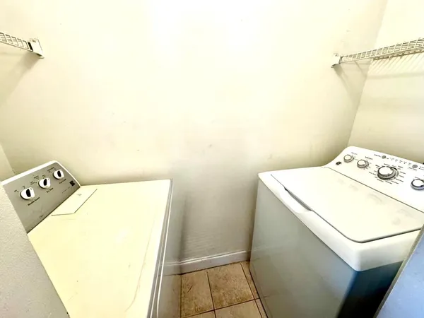 a view of a lake with a table and chairs