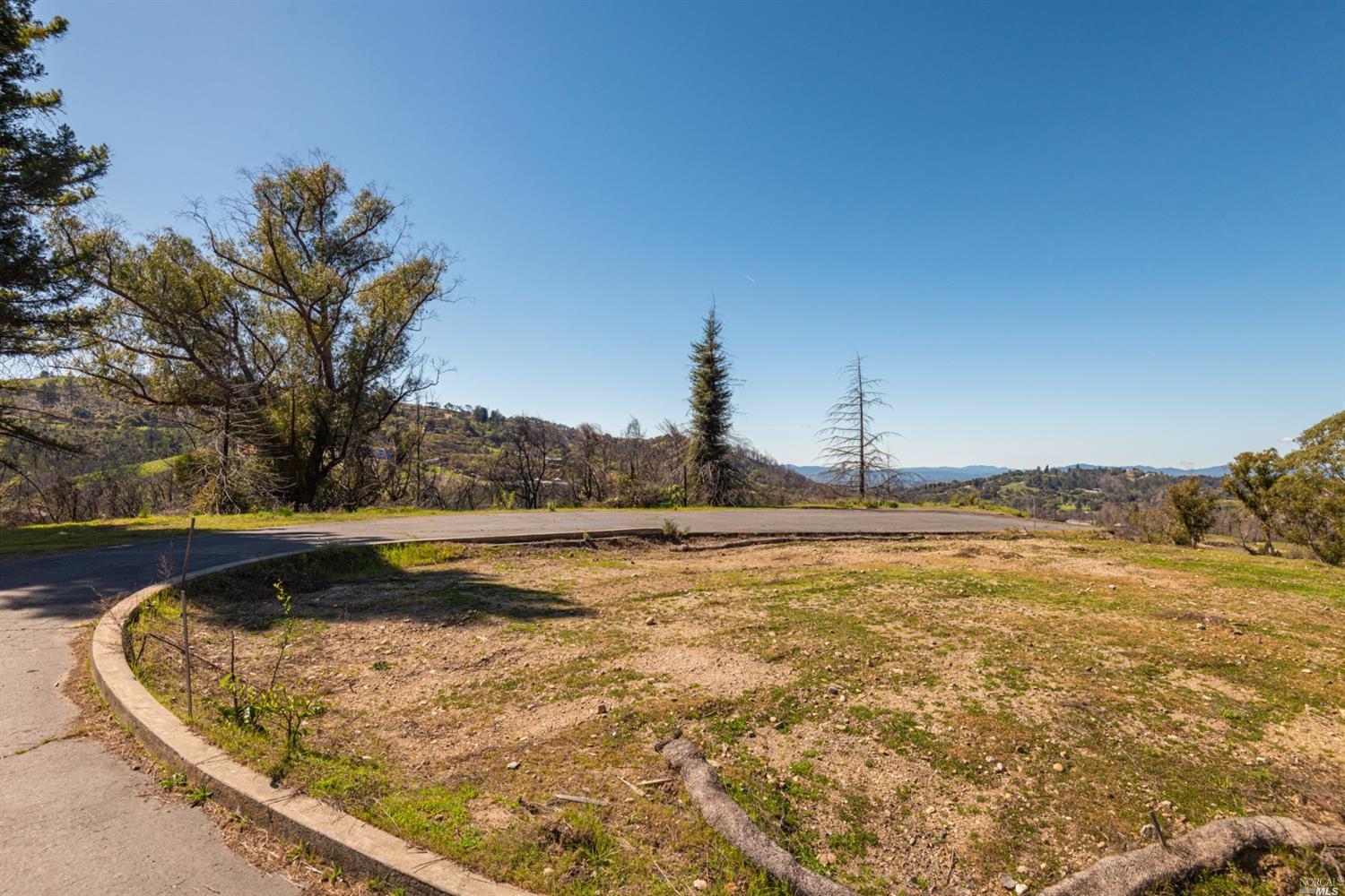 937 Sundown Trail Santa Rosa, CA 95404 - Photo 1 of 1 a view of a swimming pool with a yard and large trees