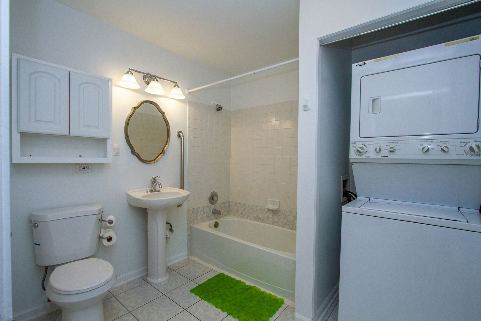 3265 Kirchoff Road, Unit 223 Rolling Meadows, IL 60008 - Photo 9 of 12 a bathroom with a sink toilet and shower