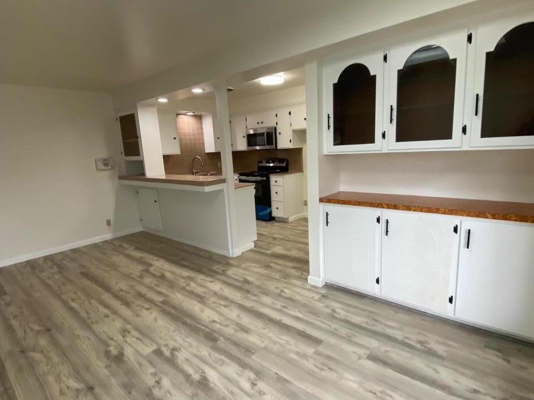 a view of a kitchen with cabinets
