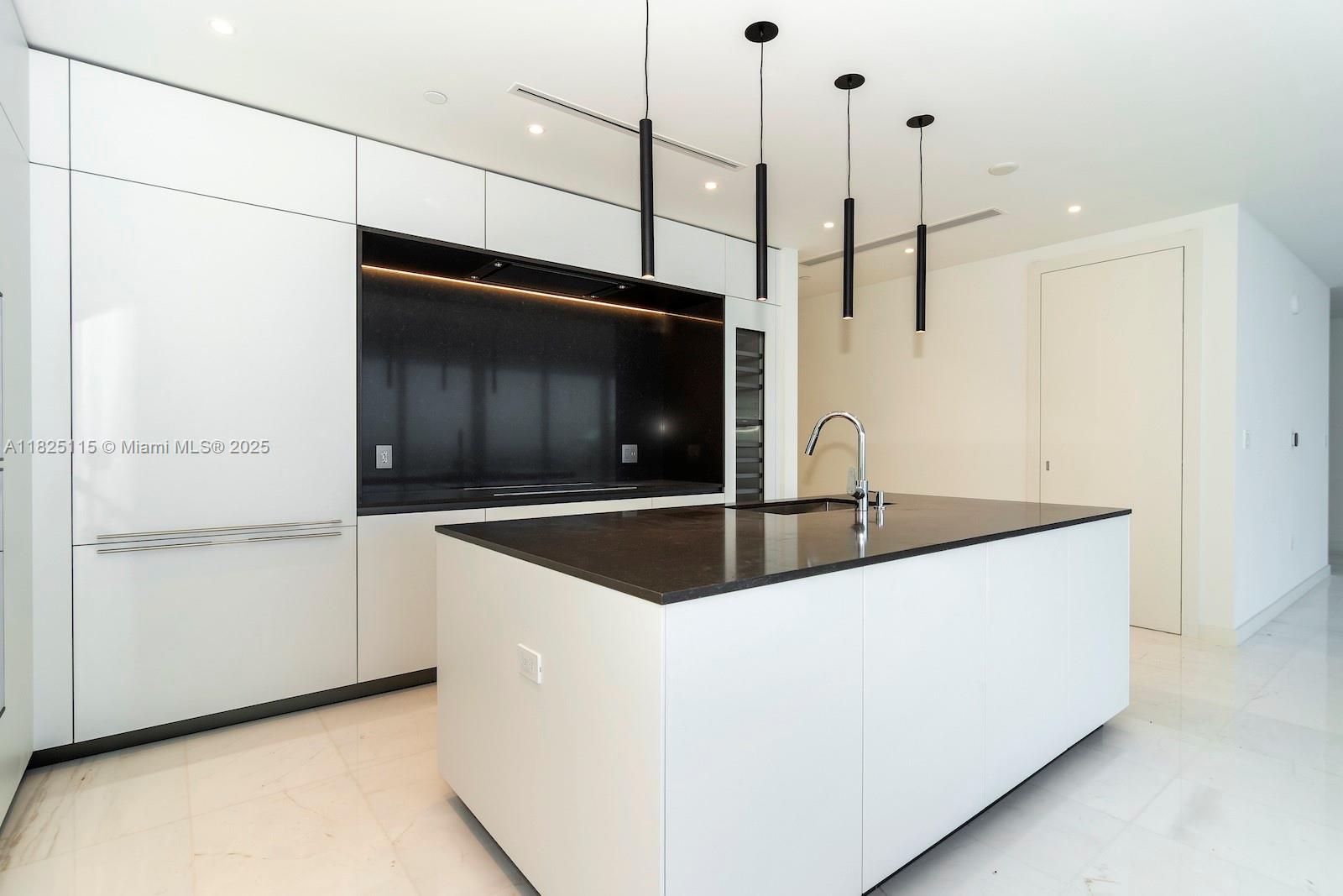 300 Biscayne Blvd Way, Unit 3902 Miami, FL 33131 - Photo 14 of 41 a kitchen with stainless steel appliances a microwave and a sink