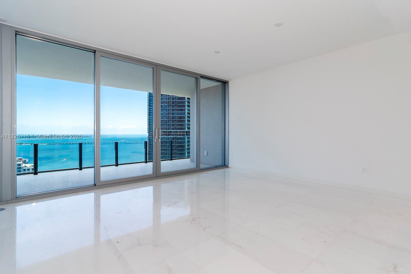 300 Biscayne Blvd Way, Unit 3902 Miami, FL 33131 - Photo 19 of 41 an empty room with sliding glass door and road