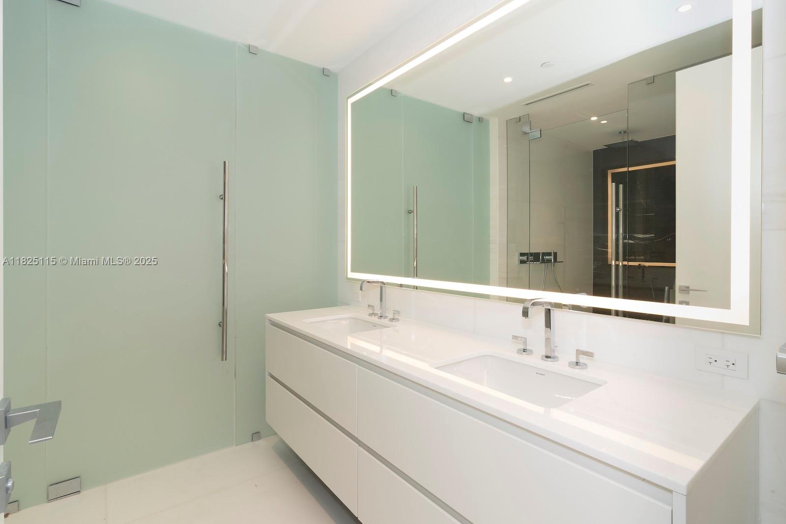 300 Biscayne Blvd Way, Unit 3902 Miami, FL 33131 - Photo 29 of 41 a bathroom with a sink and a mirror