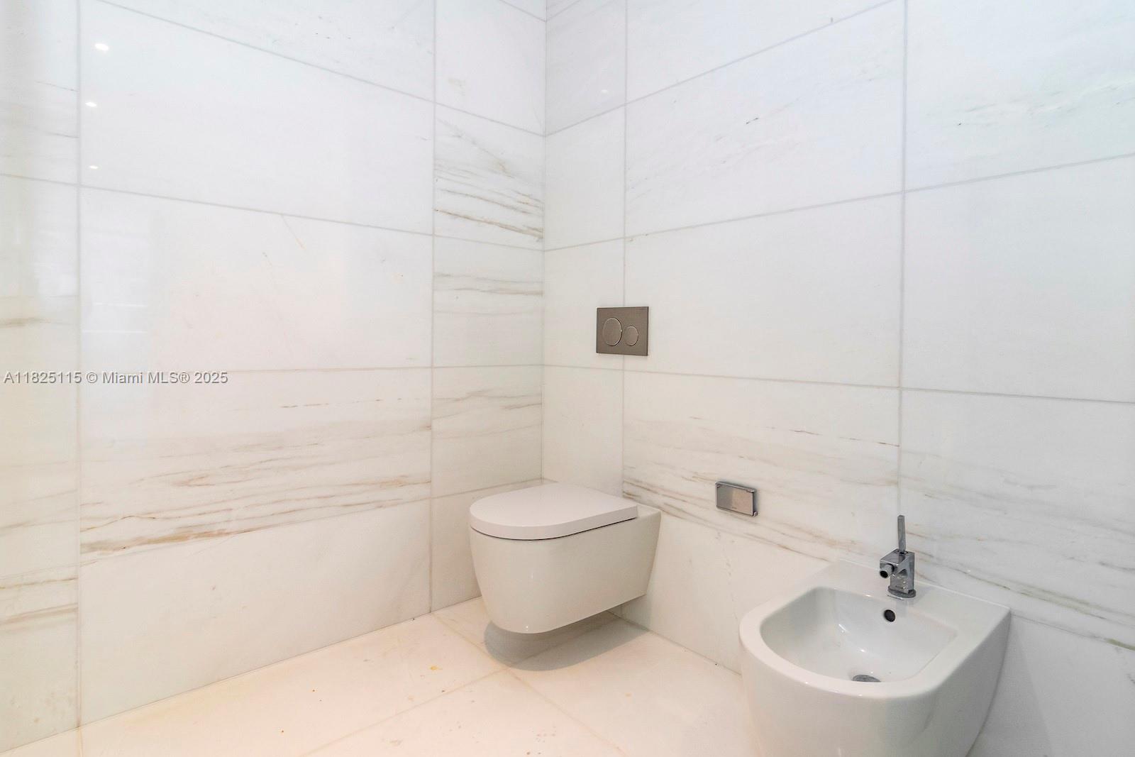 300 Biscayne Blvd Way, Unit 3902 Miami, FL 33131 - Photo 33 of 41 a bathroom with a toilet sink and shower