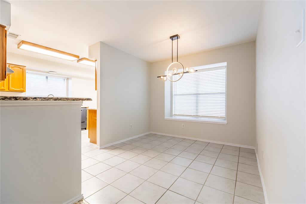 809 Simon Drive Plano, TX 75025 - Photo 17 of 24 a view of a kitchen with a sink cabinets and a window