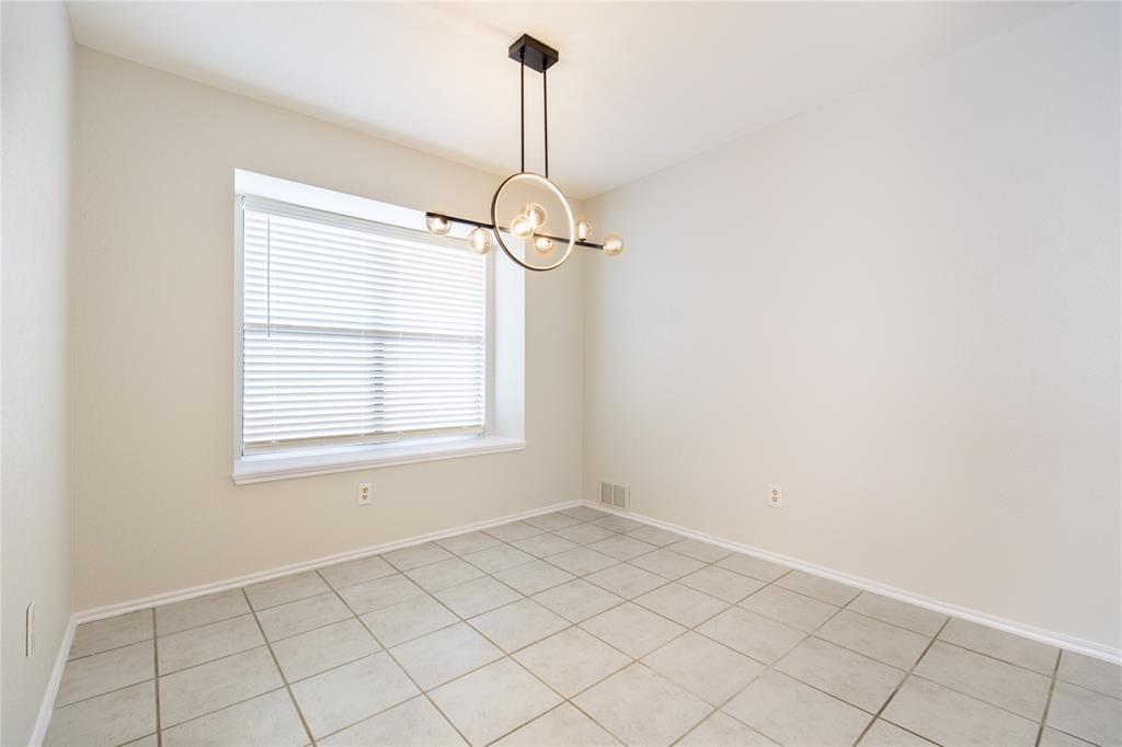 809 Simon Drive Plano, TX 75025 - Photo 18 of 24 a view of an empty room with a window