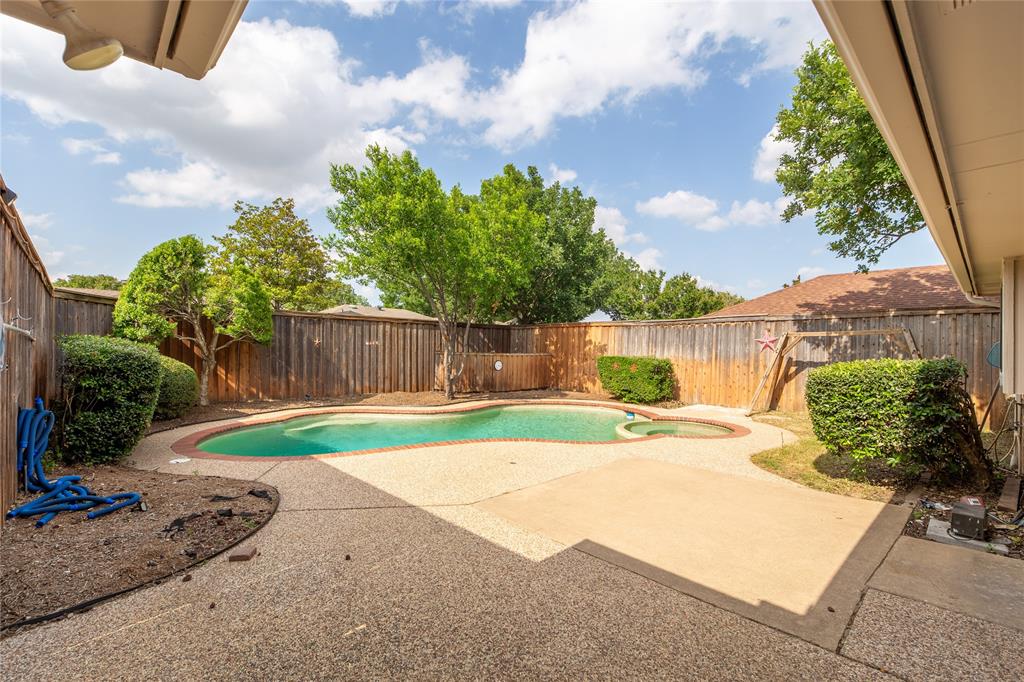 809 Simon Drive Plano, TX 75025 - Photo 22 of 24 a view of a backyard