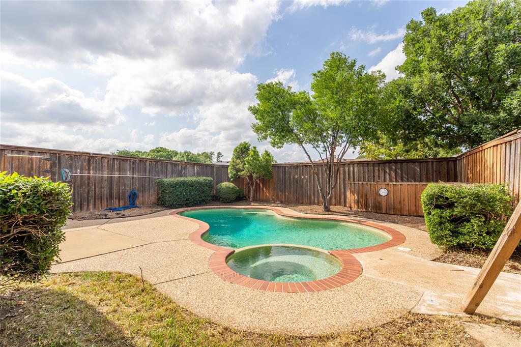 809 Simon Drive Plano, TX 75025 - Photo 23 of 24 a view of a backyard with tree s