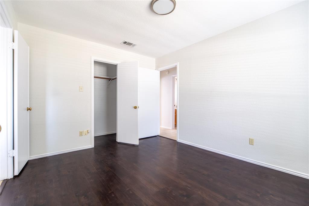 809 Simon Drive Plano, TX 75025 - Photo 6 of 24 a view of an empty room with wooden floor