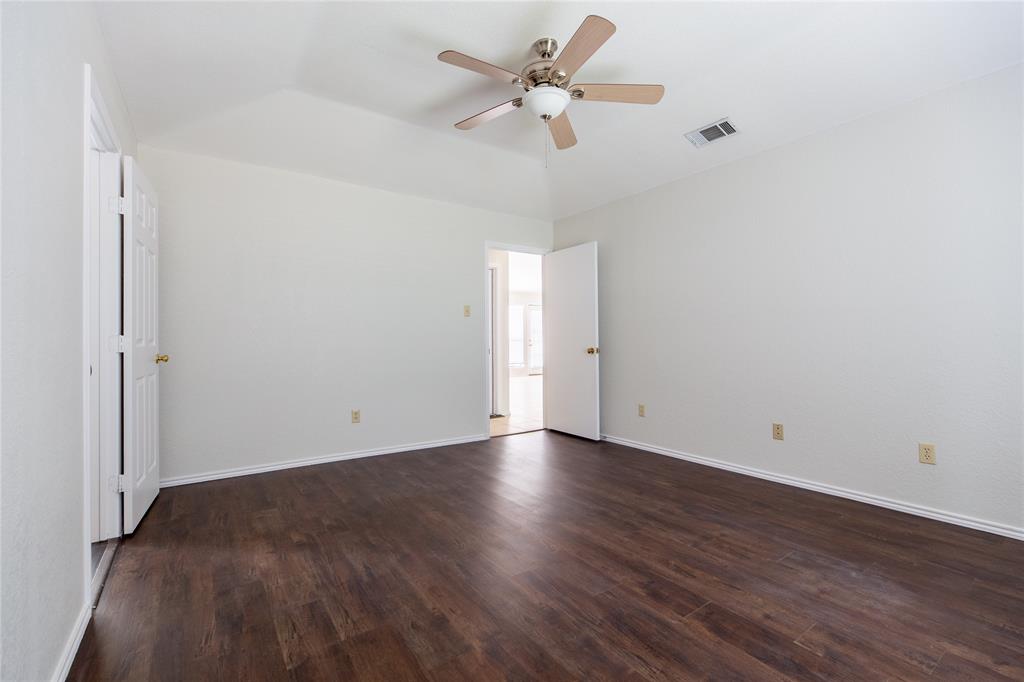 809 Simon Drive Plano, TX 75025 - Photo 9 of 24 a view of an empty room with a window
