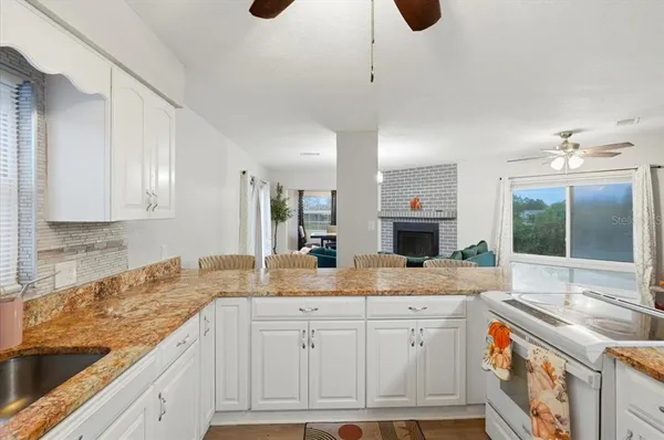 a view of a sink and a window
