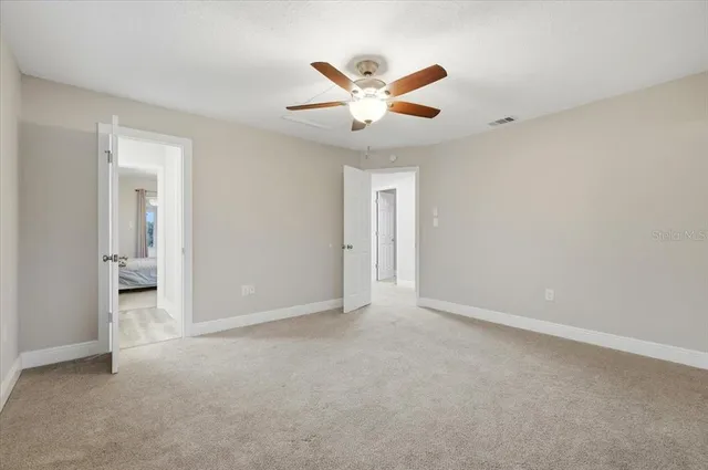 a bathroom with a toilet and a bath tub