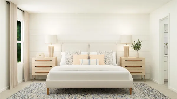 a bedroom with a bed and a cabinets