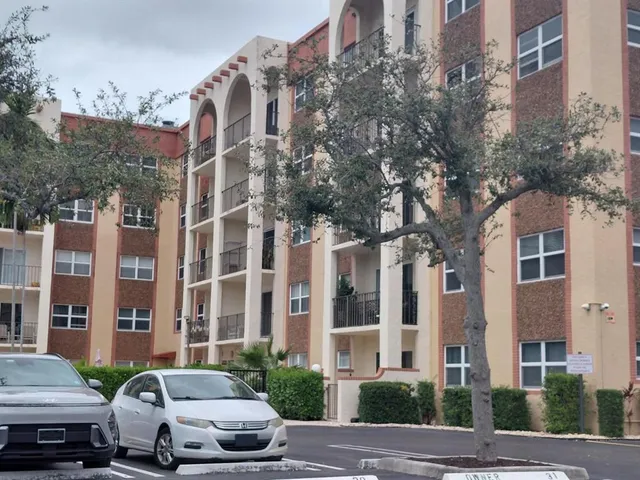 a car parked in front of a brick building