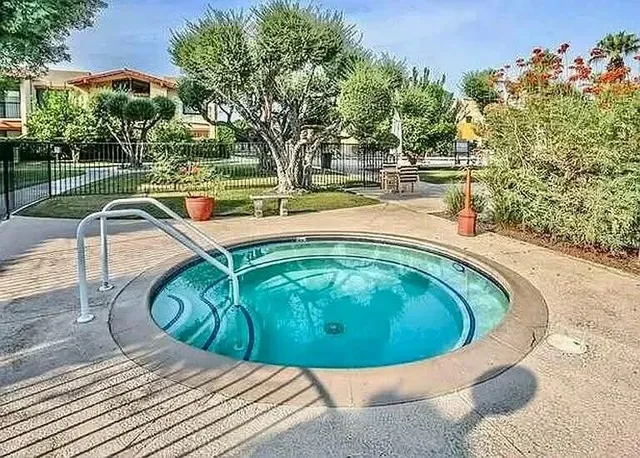 a view of a swimming pool with a patio
