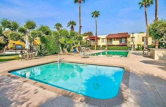 a view of a swimming pool with a patio