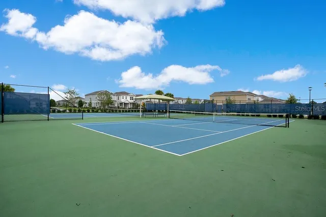 a view of outdoor space with playground and green space