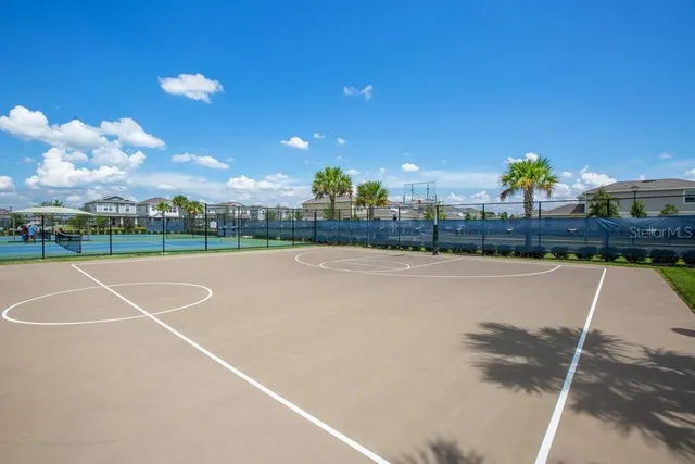 an aerial view of a house with a swimming pool