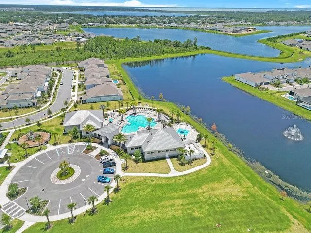 an aerial view of a city with lawn chairs