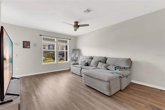 a living room with furniture and a window