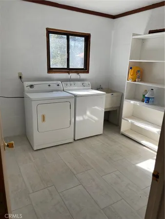 a utility room with washer and dryer