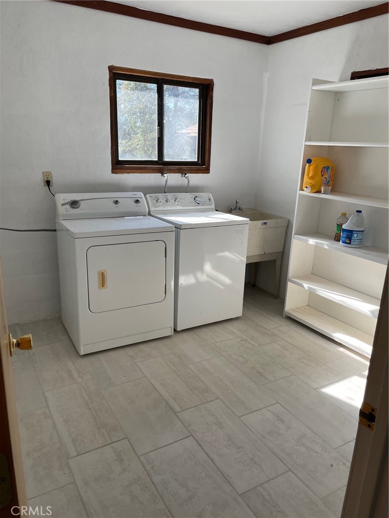 9275 Sheep Ranch Road Mountain Ranch, CA 95246 - Photo 7 of 18 a utility room with washer and dryer