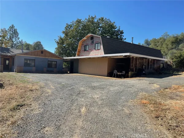a view of swimming pool in front of house