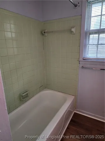 a view of room with window and ceiling fan