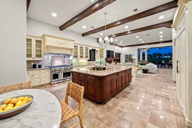 a spacious bedroom with a bed and a flat screen tv