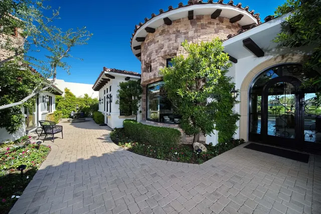 a living room with fireplace furniture and a flat screen tv