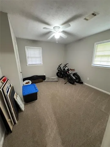 a bed room with furniture and a window