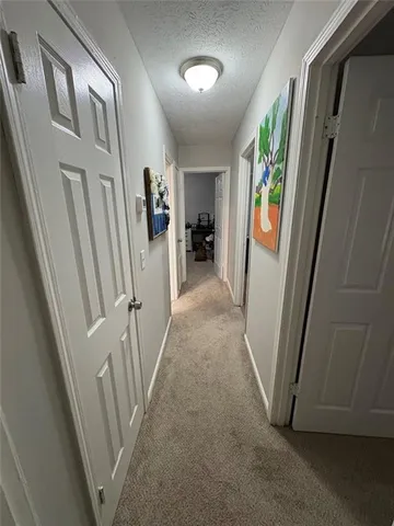 a view of a hallway view with staircase