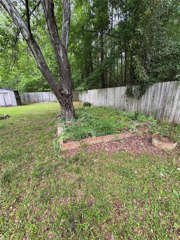 38 Daniel Circle Franklin, GA 30217 - Photo 22 of 27 a view of backyard with large trees and wooden fence