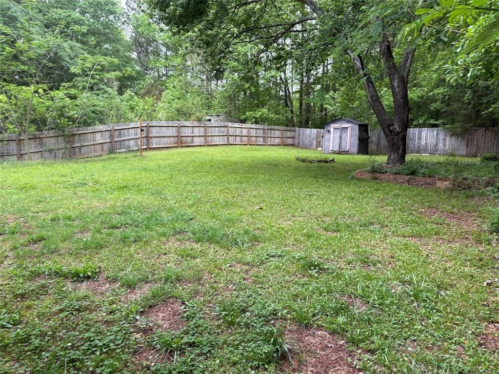 38 Daniel Circle Franklin, GA 30217 - Photo 25 of 27 a view of a backyard with a garden and trees