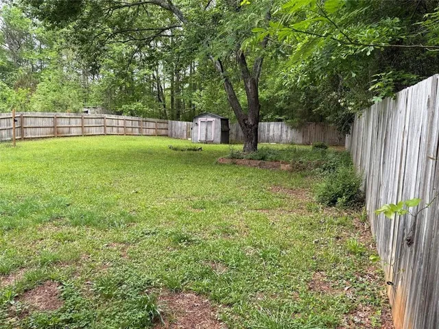 a view of a backyard with a small cabin