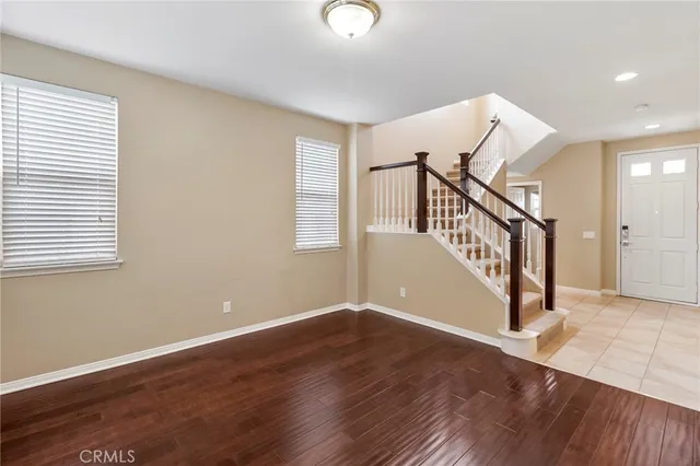 a view of an entryway with wooden floor