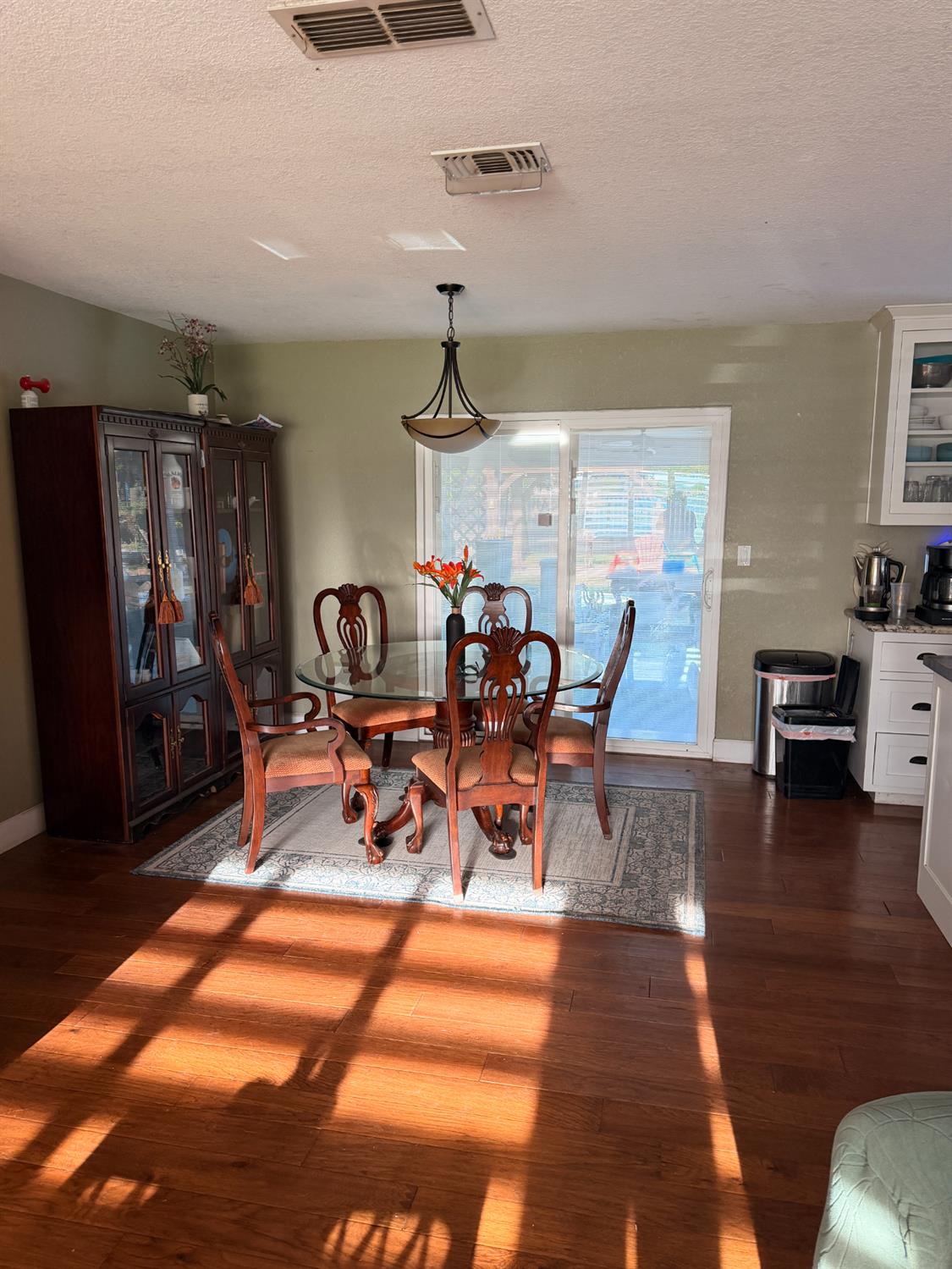 5645 20th Street Rio Linda, CA 95673 - Photo 24 of 69 dining room featuring dark wood-style floors and a textured ceiling, multiple ceiling vents