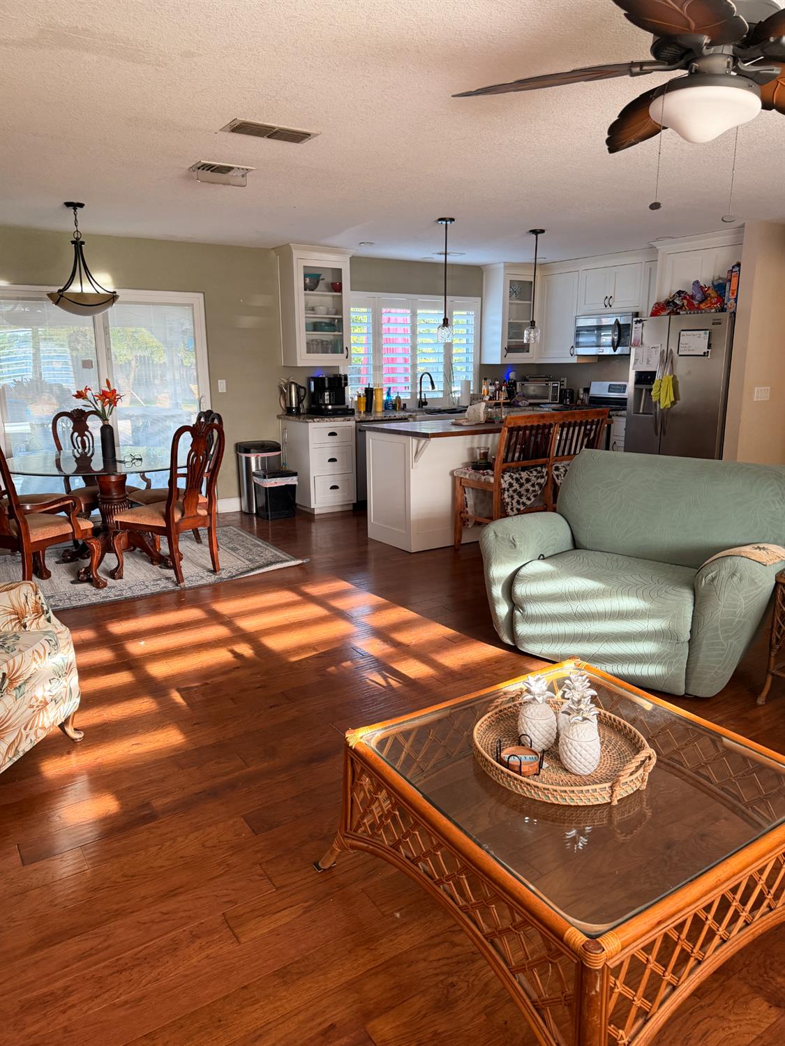 5645 20th Street Rio Linda, CA 95673 - Photo 26 of 69 living room with dark wood finished floors, a ceiling fan, and a textured ceiling