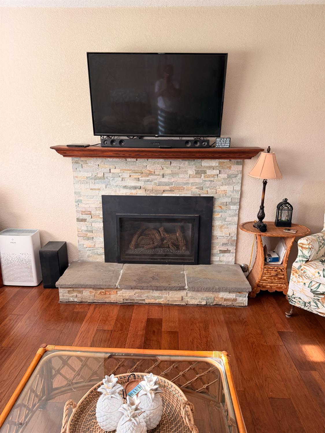 5645 20th Street Rio Linda, CA 95673 - Photo 30 of 69 detailed view of a gas fireplace insert, wood finished floors, and a textured wall