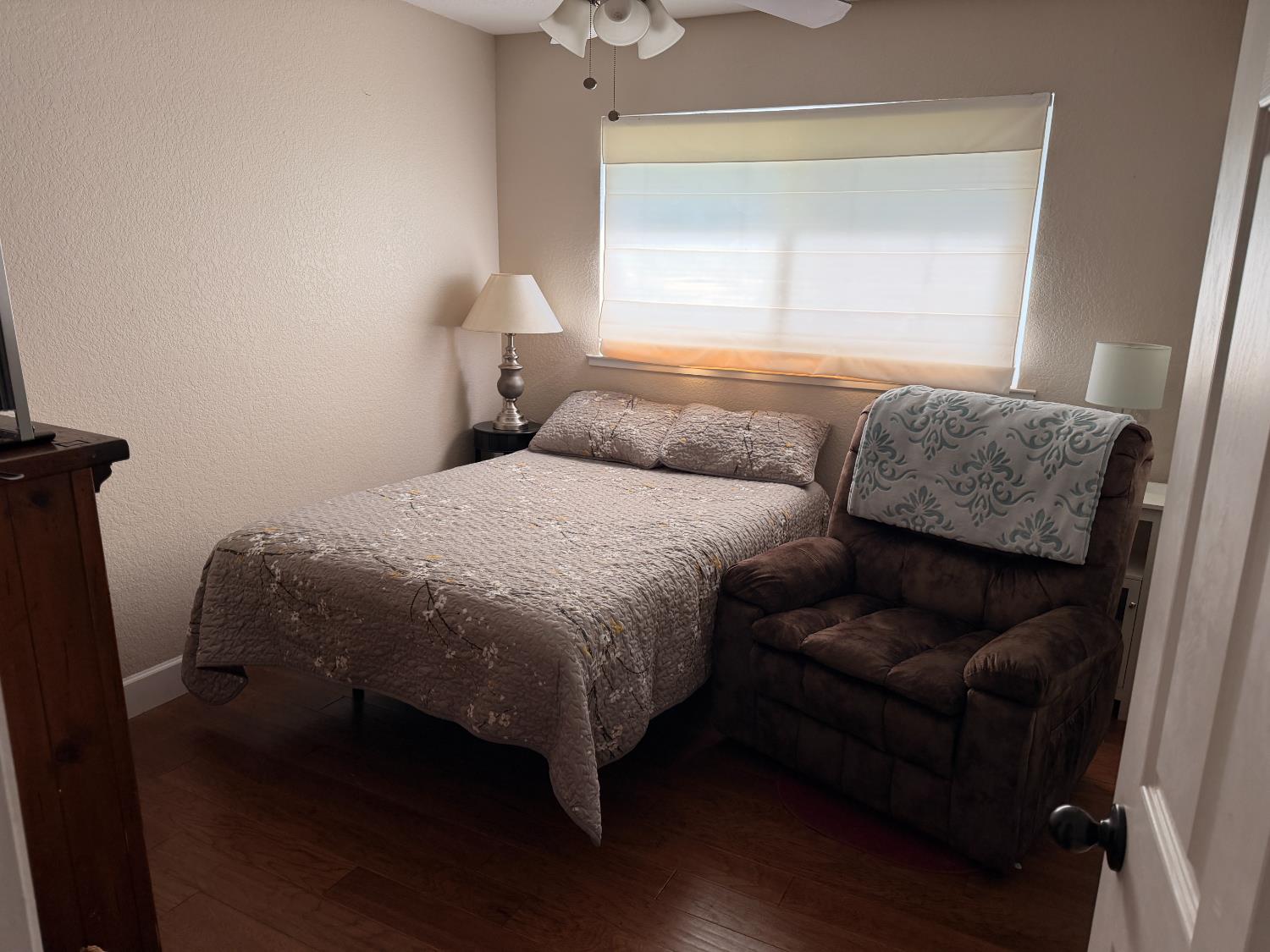 5645 20th Street Rio Linda, CA 95673 - Photo 37 of 69 bedroom featuring a textured wall, ceiling fan, and wood finished floors