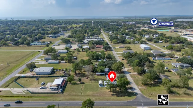 an aerial view of residential houses with outdoor space