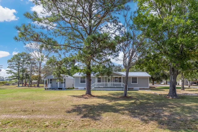 a view of a house with a tree