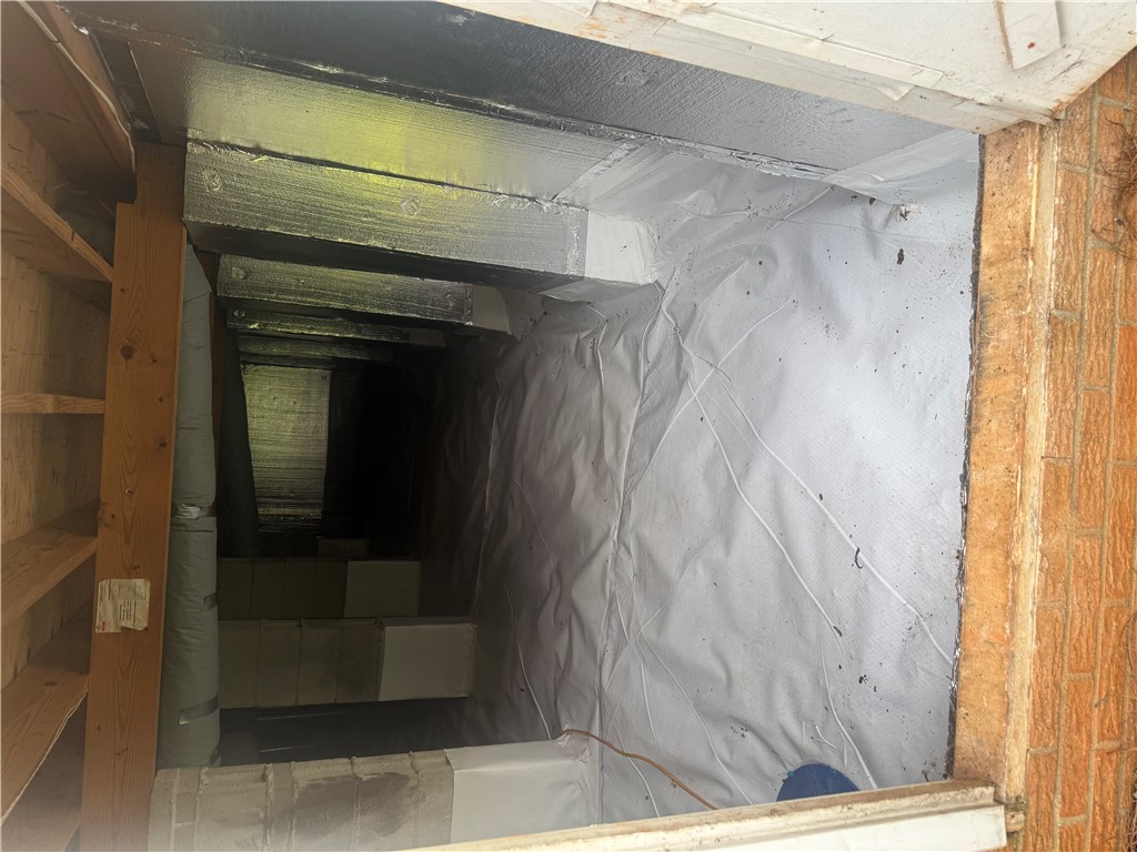 4027 Belhaven Road Belton, SC 29627 - Photo 19 of 24 Clean, encapsulated crawl space featuring robust structural beams and a moisture barrier for ultimate home protection.