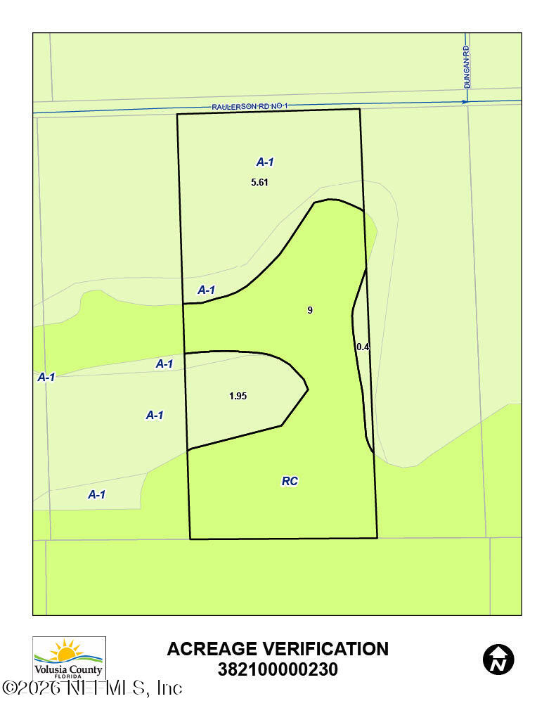 525 Raulerson Road Seville, FL 32190 - Photo 2 of 32 a black and white photo of a field