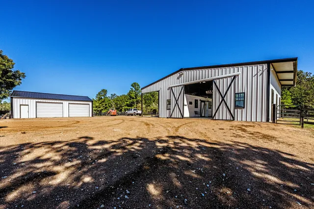 a view of yellow house with a yard