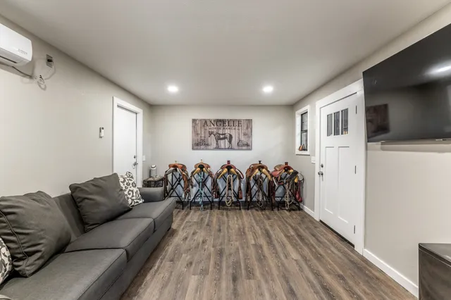an aerial view of a house with yard and outdoor seating