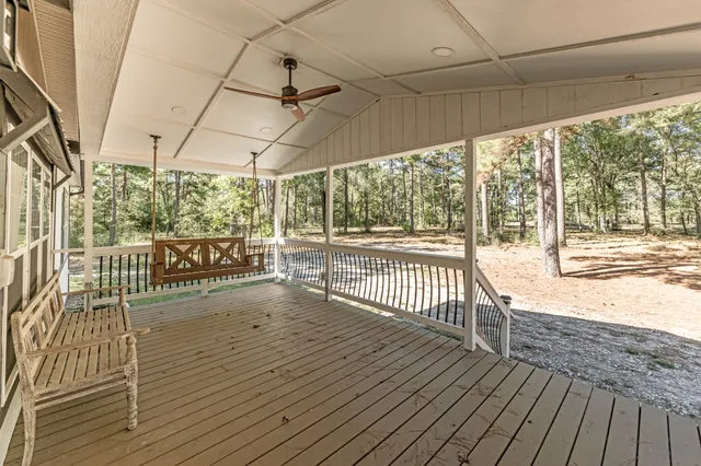 a kitchen with stainless steel appliances granite countertop a kitchen island a stove a refrigerator a sink and a stove