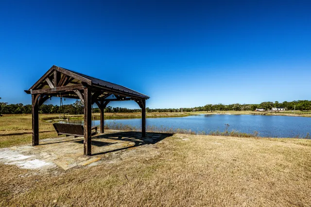 a view of swimming pool with a yard